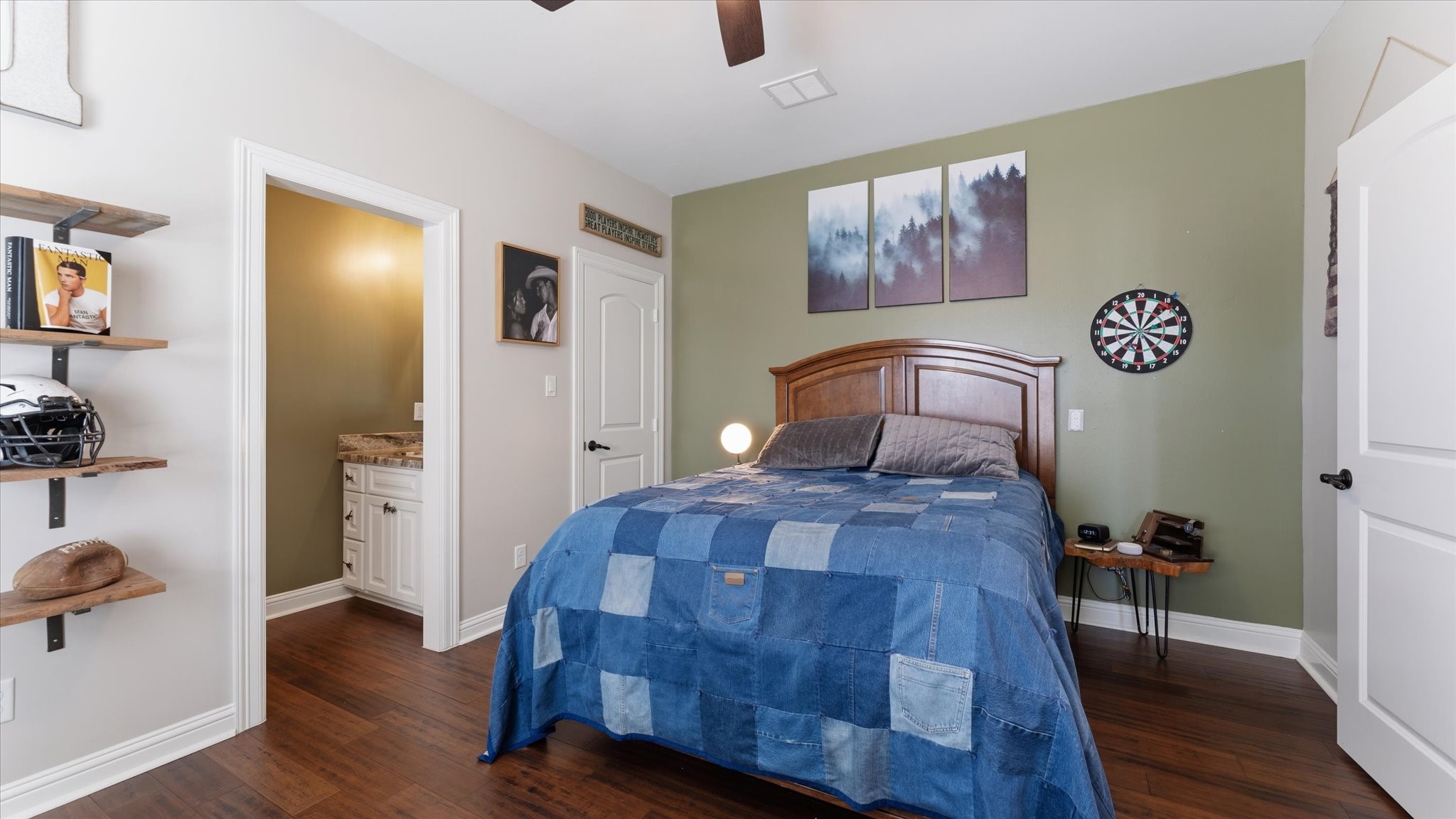 24 Longhorn Loop New Waverly, TX 77358 - Photo 26 of 45 a bedroom with a bed and wooden floor