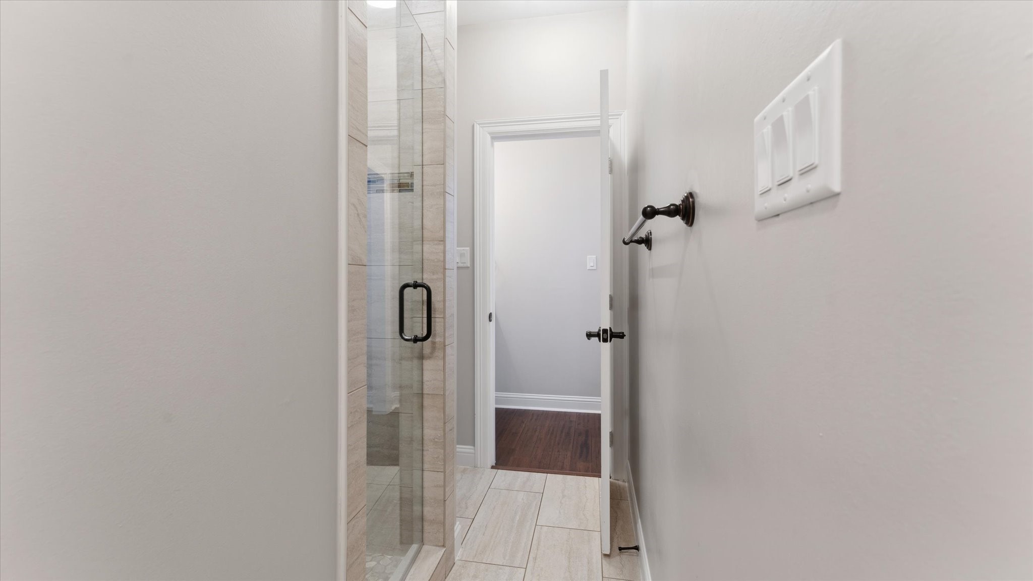 24 Longhorn Loop New Waverly, TX 77358 - Photo 28 of 45 a bathroom with a glass shower door