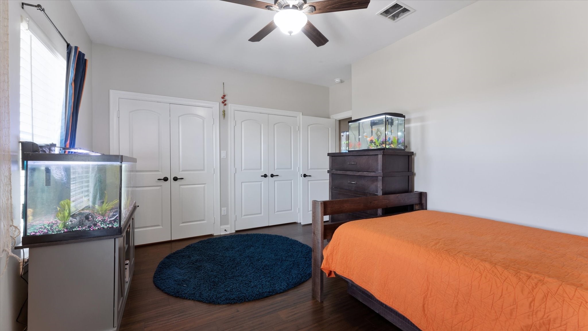 24 Longhorn Loop New Waverly, TX 77358 - Photo 29 of 45 a bedroom with a bed and a dresser
