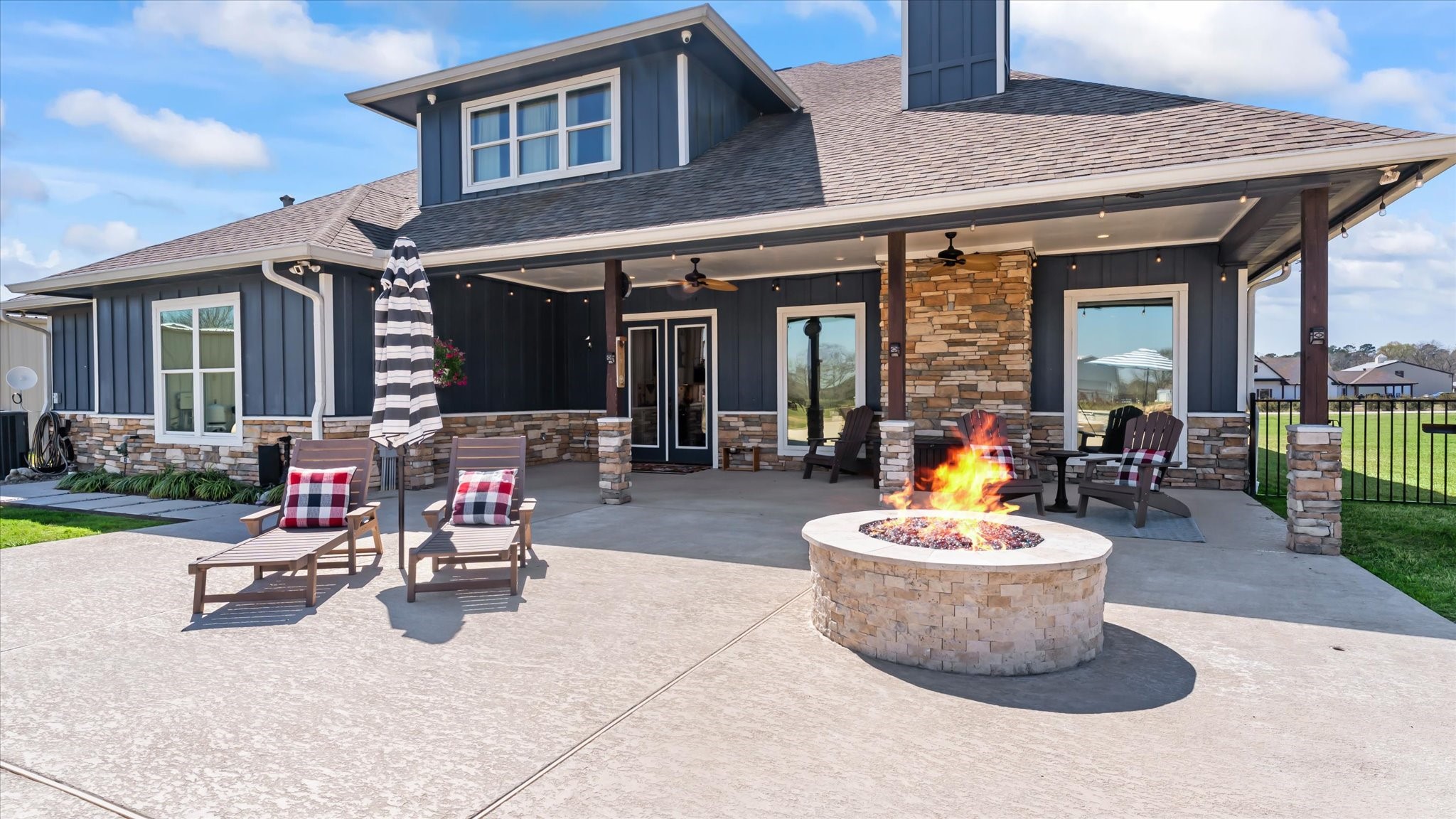 24 Longhorn Loop New Waverly, TX 77358 - Photo 4 of 45 a view of a chairs and a table in the patio