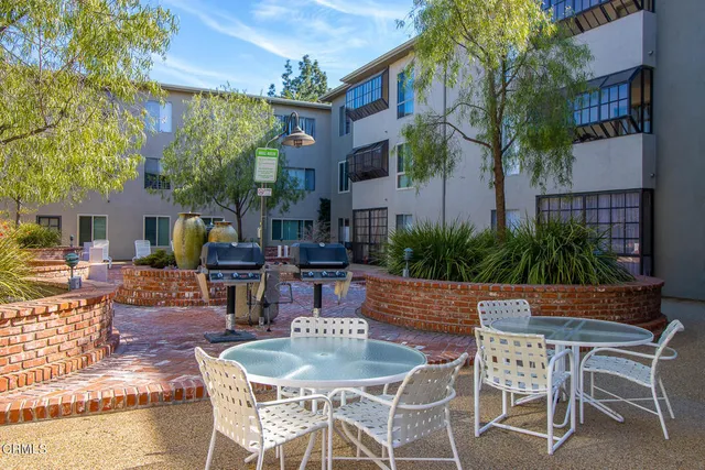 a view of outdoor dining space with a patio and fire pit