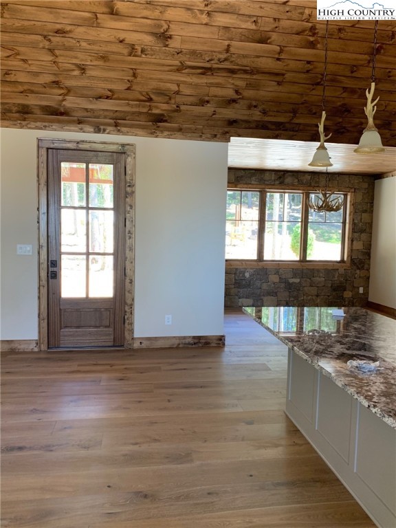 479 Rippling Waters Trail Banner Elk, NC 28604 - Photo 20 of 46 a view of a room with wooden floor and a floor to ceiling window