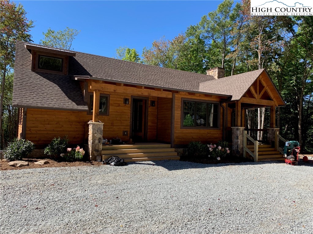 479 Rippling Waters Trail Banner Elk, NC 28604 - Photo 2 of 46 a front view of a house with a yard