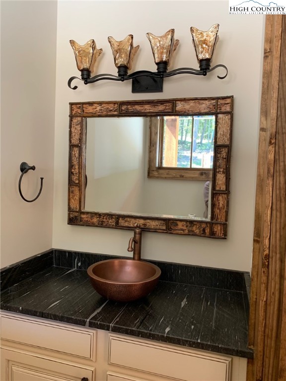 479 Rippling Waters Trail Banner Elk, NC 28604 - Photo 22 of 46 a bathroom with a sink and a mirror