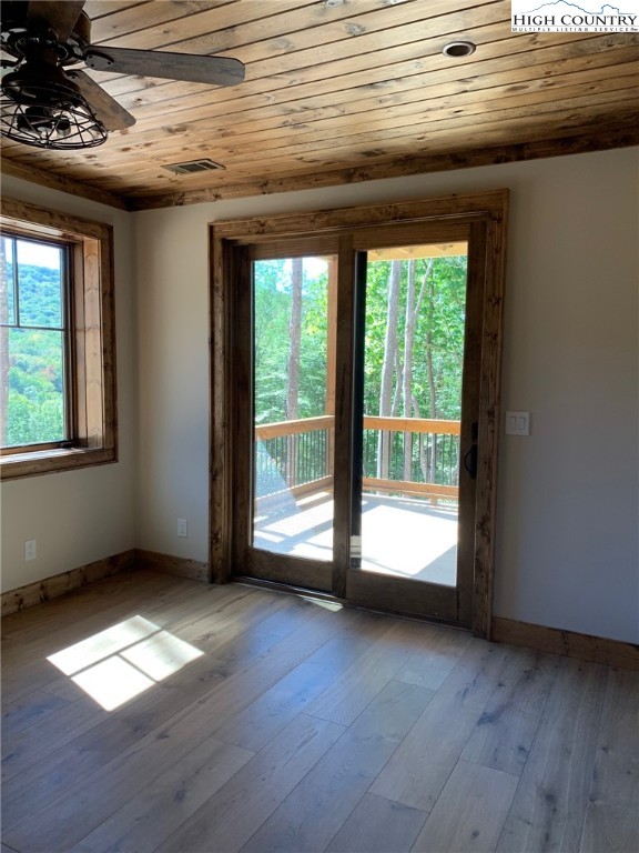 479 Rippling Waters Trail Banner Elk, NC 28604 - Photo 25 of 46 a view of empty room with wooden floor and fan
