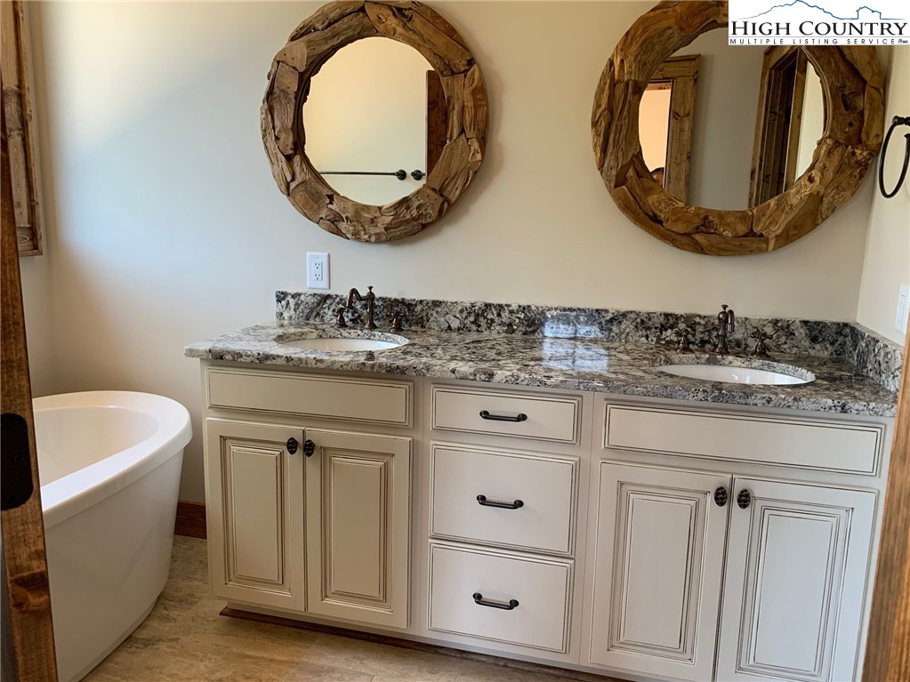 479 Rippling Waters Trail Banner Elk, NC 28604 - Photo 26 of 46 a bathroom with a sink and a mirror