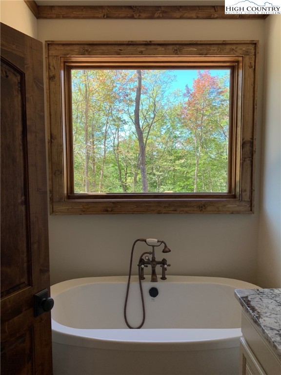 479 Rippling Waters Trail Banner Elk, NC 28604 - Photo 27 of 46 a bathroom with a tub and a window