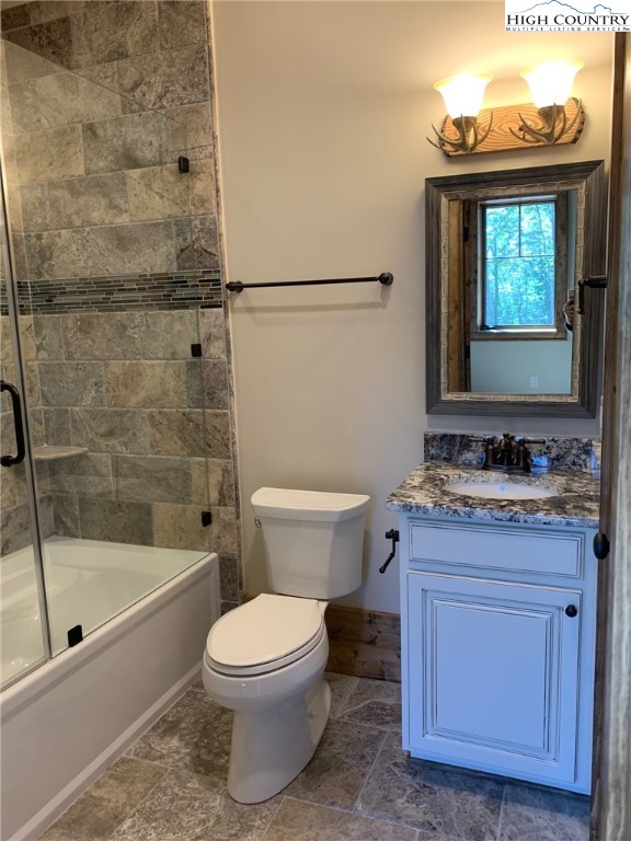 479 Rippling Waters Trail Banner Elk, NC 28604 - Photo 35 of 46 a bathroom with a granite countertop sink toilet and shower