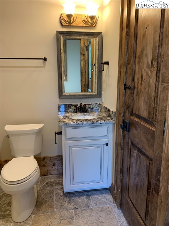 479 Rippling Waters Trail Banner Elk, NC 28604 - Photo 37 of 46 a bathroom with a toilet sink and mirror