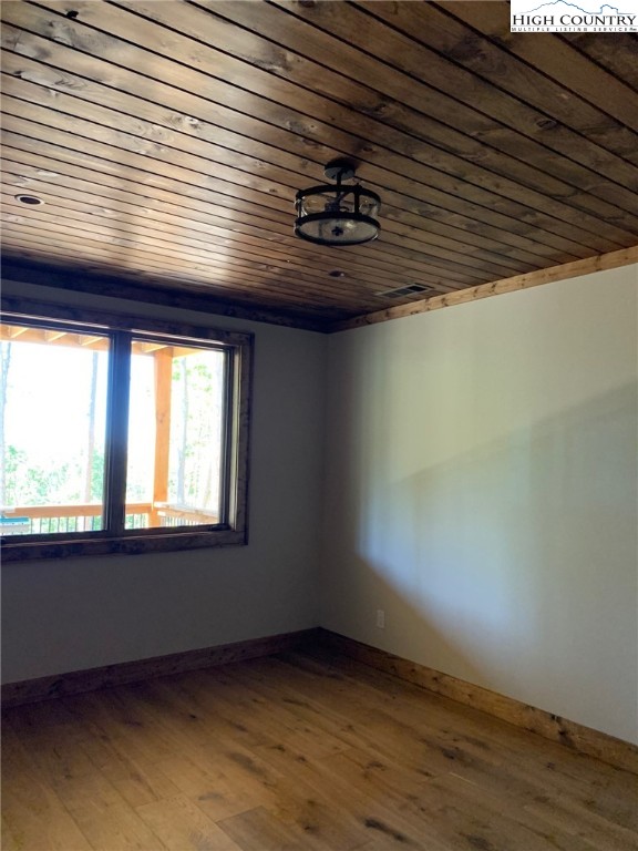 479 Rippling Waters Trail Banner Elk, NC 28604 - Photo 39 of 46 a view of an empty room with wooden floor and a window