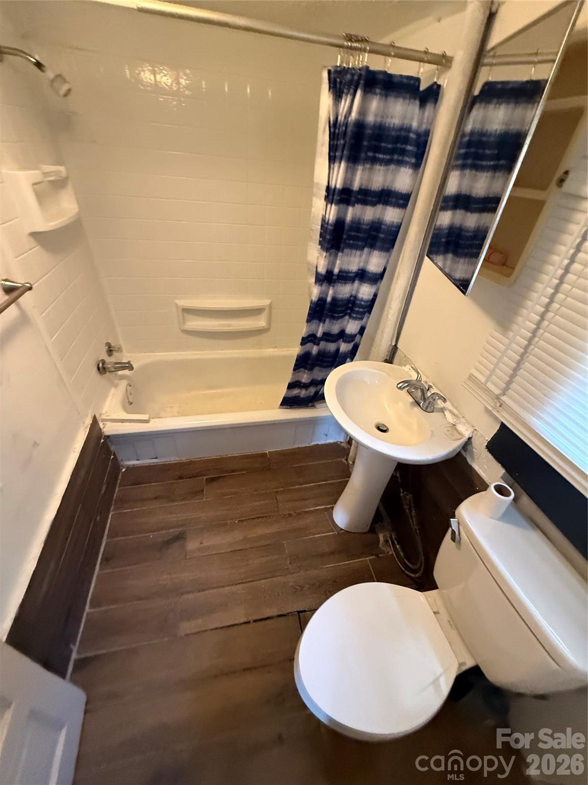 965 13th Street Lancaster, SC 29720 - Photo 13 of 17 a bathroom with a sink and a mirror