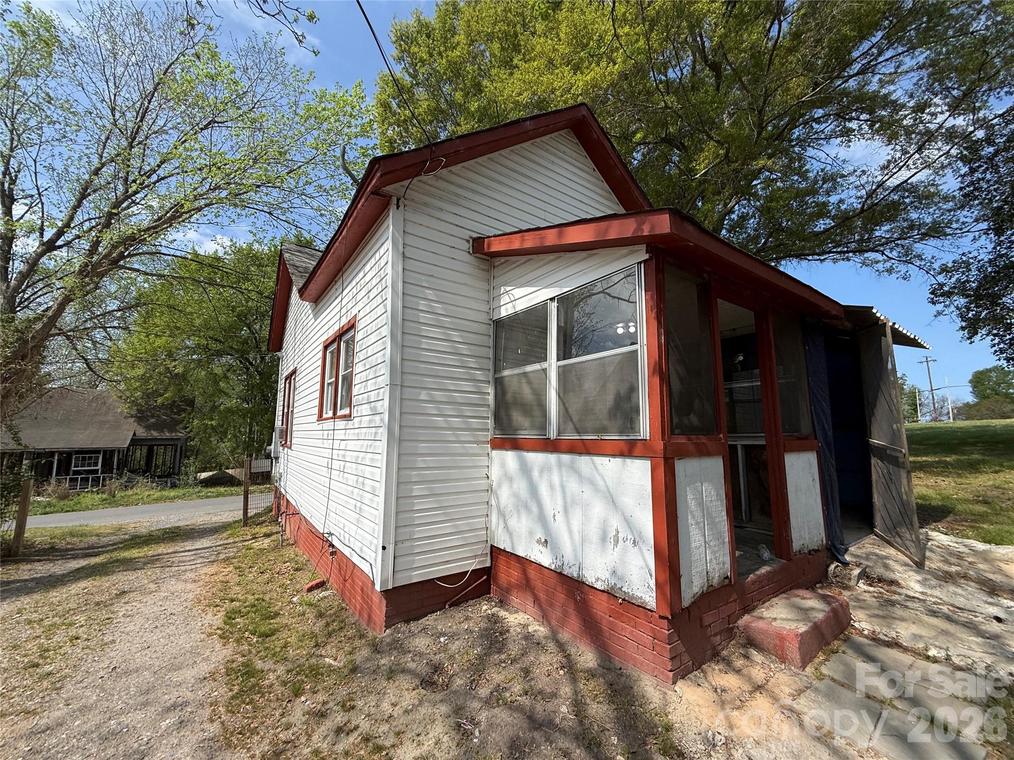 965 13th Street Lancaster, SC 29720 - Photo 8 of 17 a backyard of a house with oven and tree