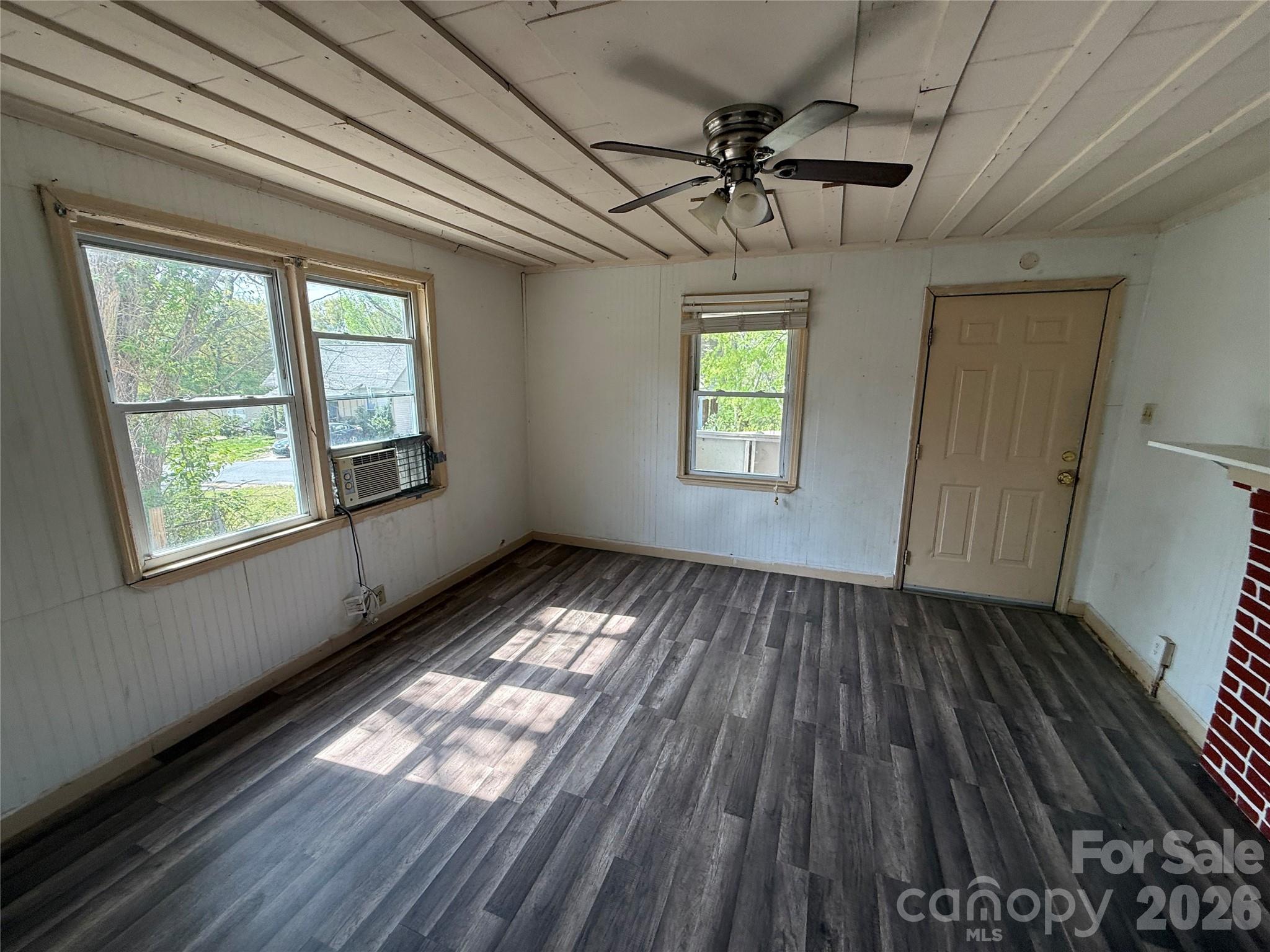 965 13th Street Lancaster, SC 29720 - Photo 10 of 17 a view of empty room with wooden floor and windows