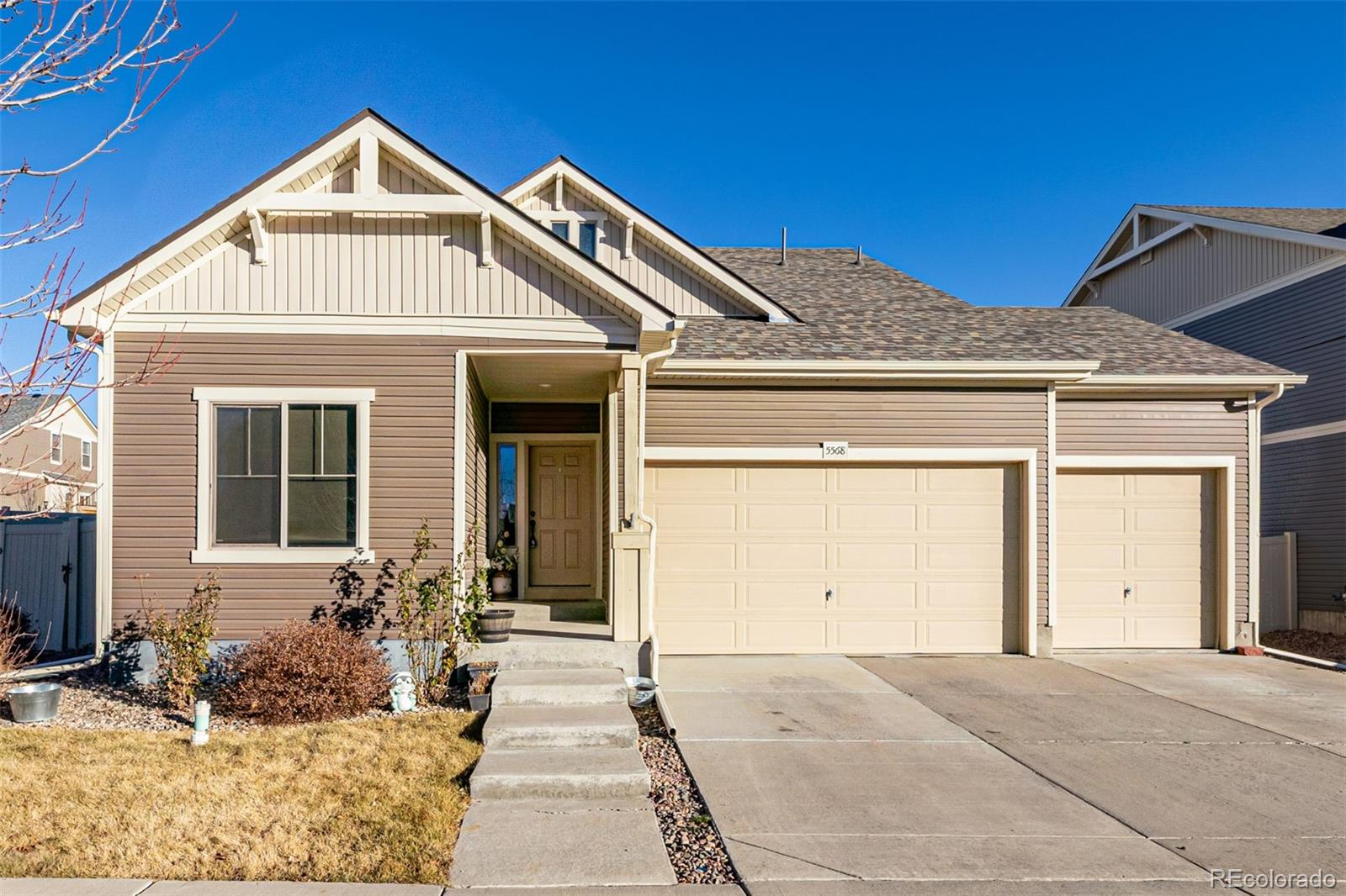 a front view of a house with a yard