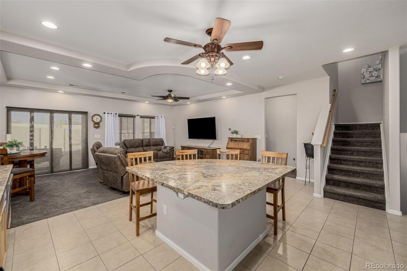 5568 Ceylon Street Denver, CO 80249 - Photo 15 of 43 a kitchen with a table and chairs