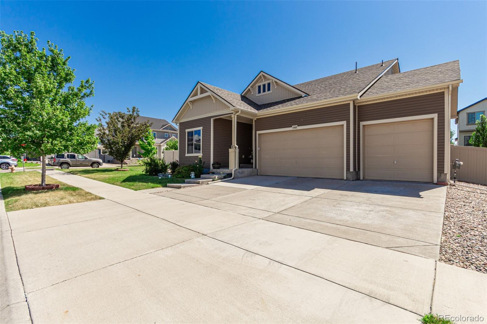 5568 Ceylon Street Denver, CO 80249 - Photo 2 of 43 a front view of a house with garden