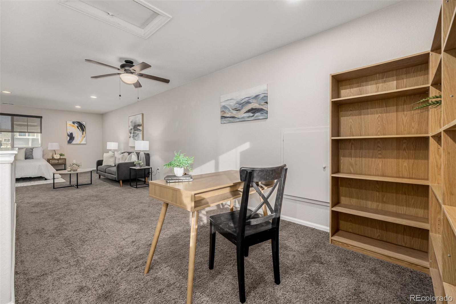 5568 Ceylon Street Denver, CO 80249 - Photo 29 of 43 a view of a livingroom with furniture and a ceiling fan