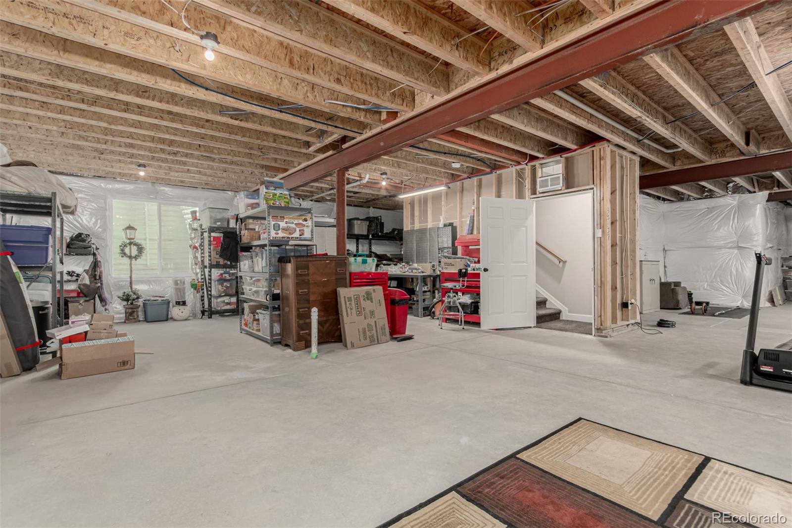 5568 Ceylon Street Denver, CO 80249 - Photo 30 of 43 a view of a storage room with utility room