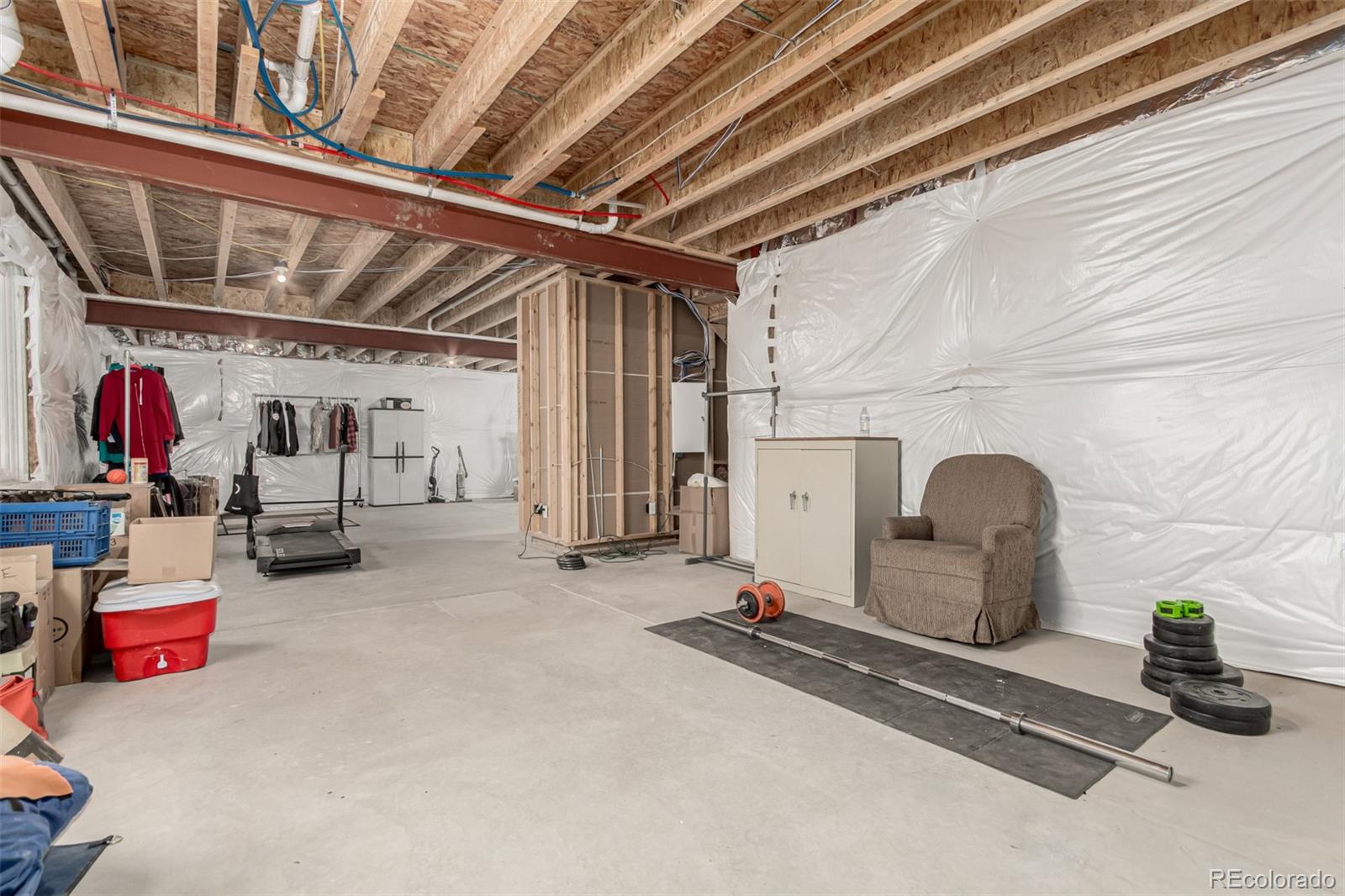 5568 Ceylon Street Denver, CO 80249 - Photo 33 of 43 a room with gym equipment