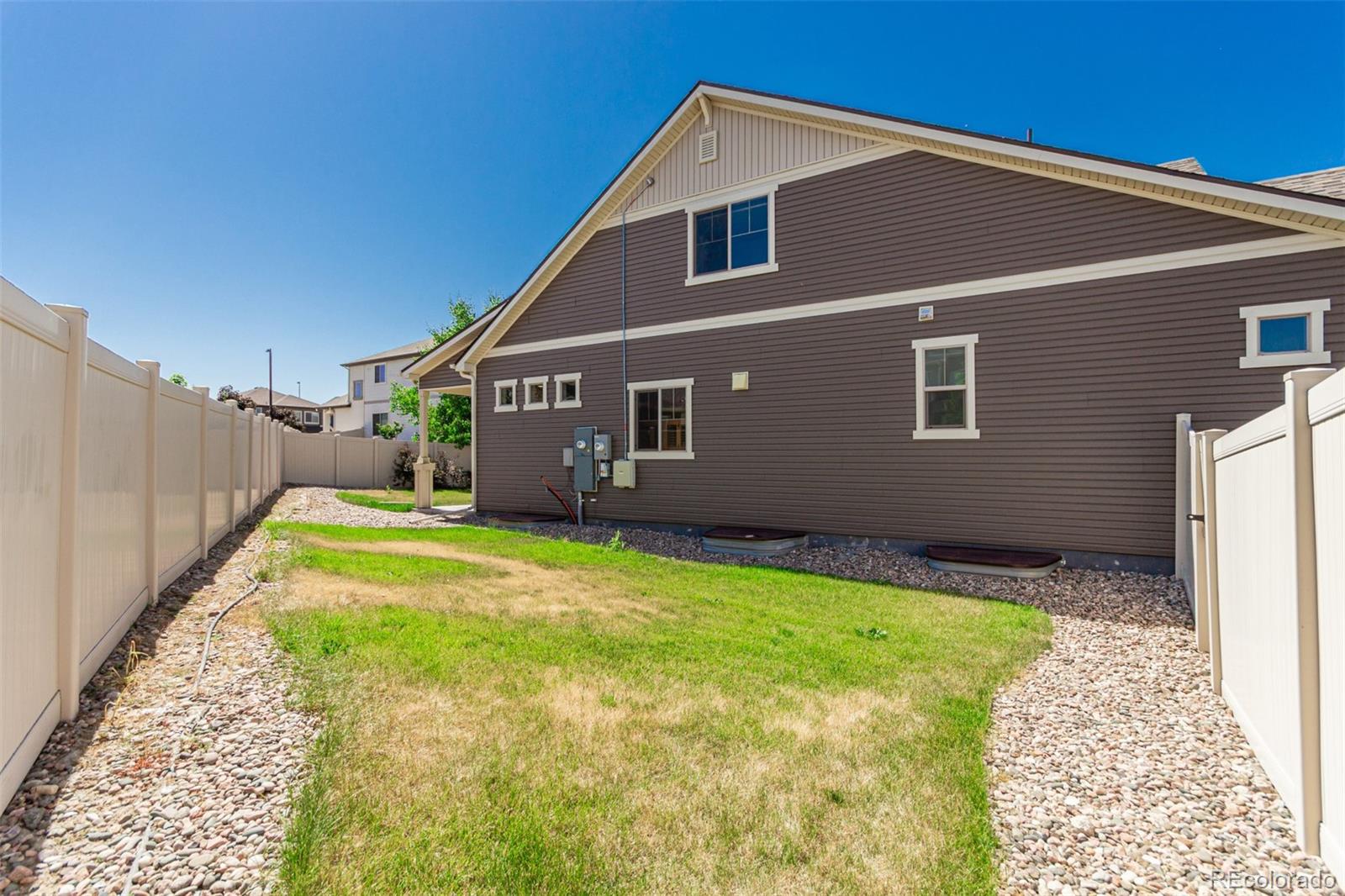 5568 Ceylon Street Denver, CO 80249 - Photo 38 of 43 a house view with a backyard space