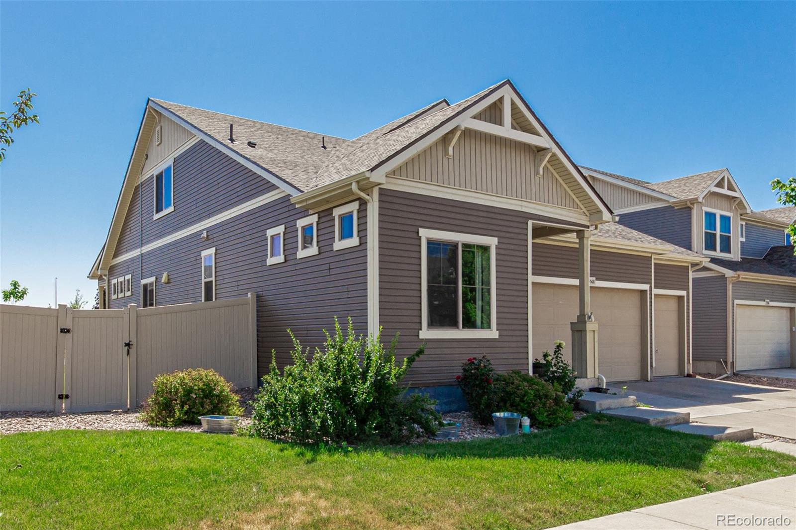 5568 Ceylon Street Denver, CO 80249 - Photo 40 of 43 a front view of a house with garden
