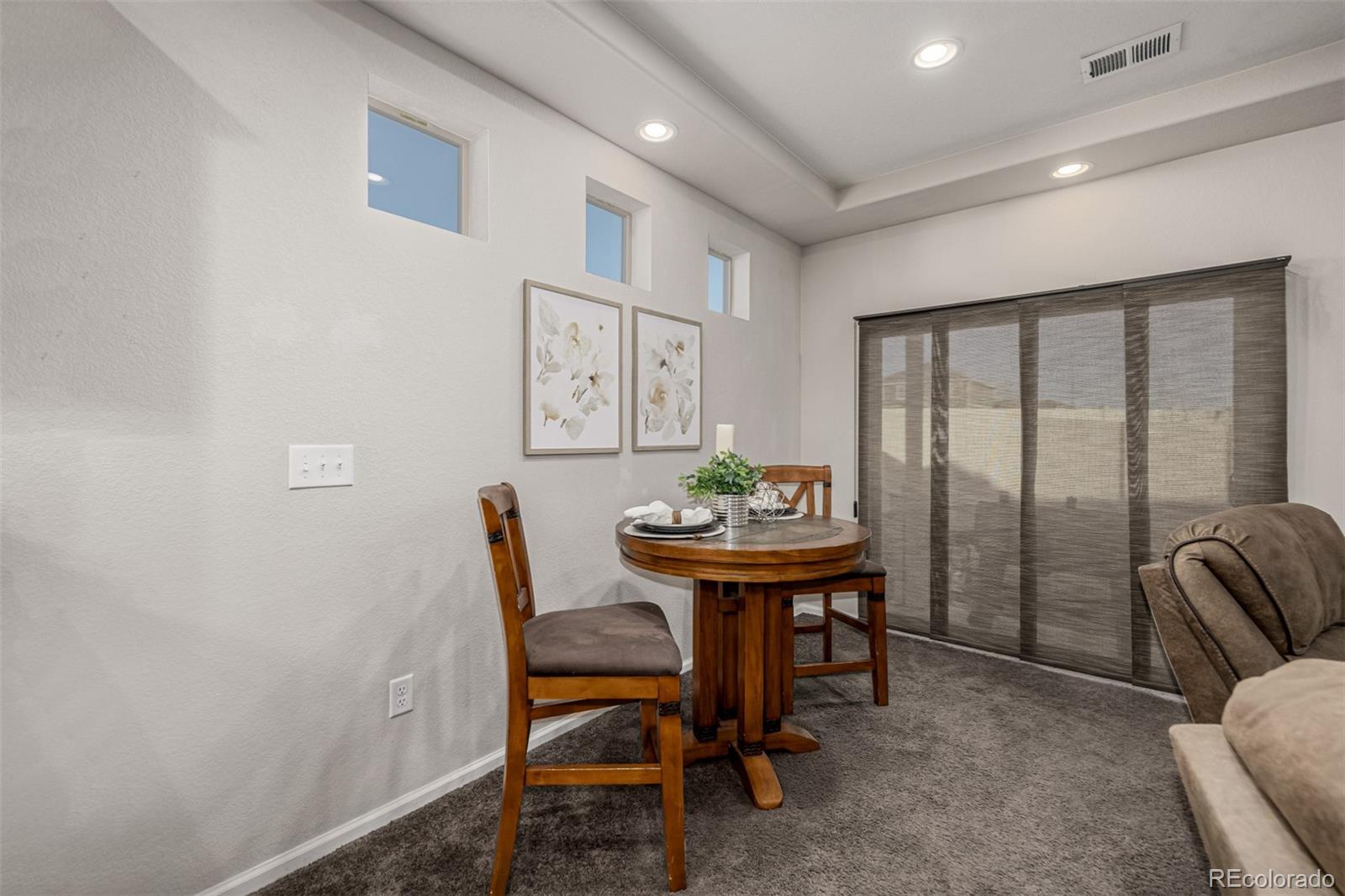 5568 Ceylon Street Denver, CO 80249 - Photo 9 of 43 a room with furniture and window