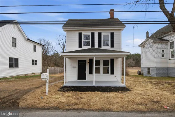 a view of a house with a small yard