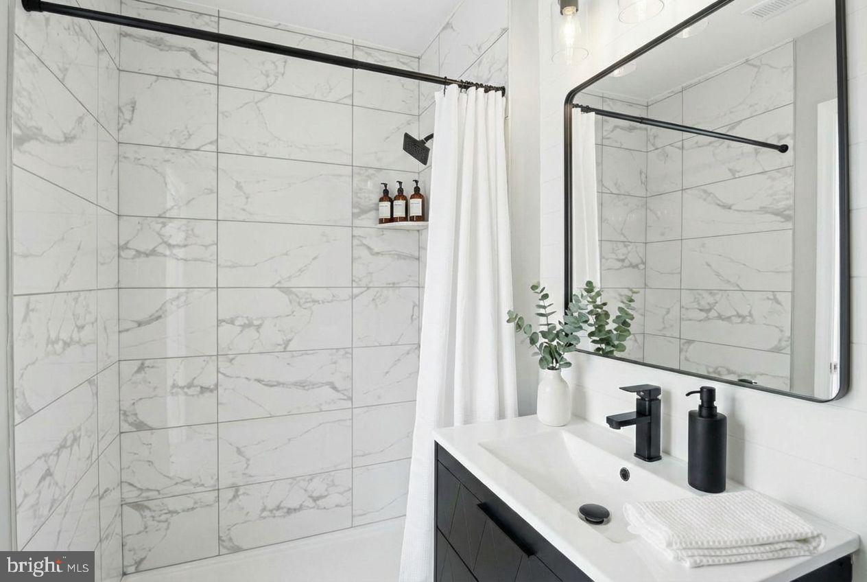 221 Denton Road Federalsburg, MD 21632 - Photo 11 of 33 a bathroom with a sink and a mirror