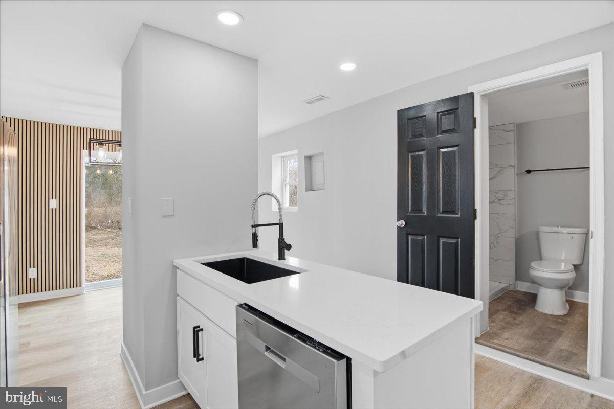 221 Denton Road Federalsburg, MD 21632 - Photo 15 of 33 a view of a kitchen island with wooden floor