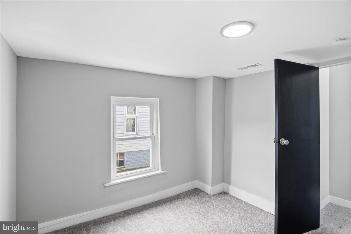 221 Denton Road Federalsburg, MD 21632 - Photo 26 of 33 an empty room with windows and closet