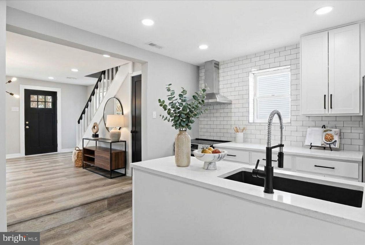 221 Denton Road Federalsburg, MD 21632 - Photo 3 of 33 a kitchen with sink refrigerator and stove
