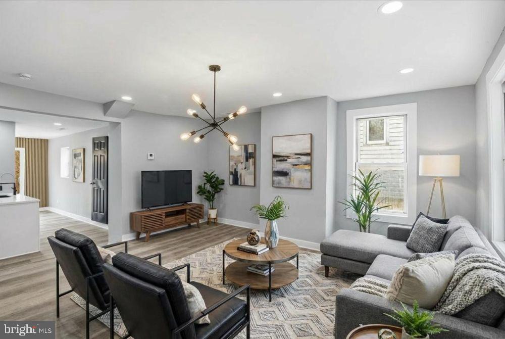 221 Denton Road Federalsburg, MD 21632 - Photo 6 of 33 a living room with furniture and a flat screen tv