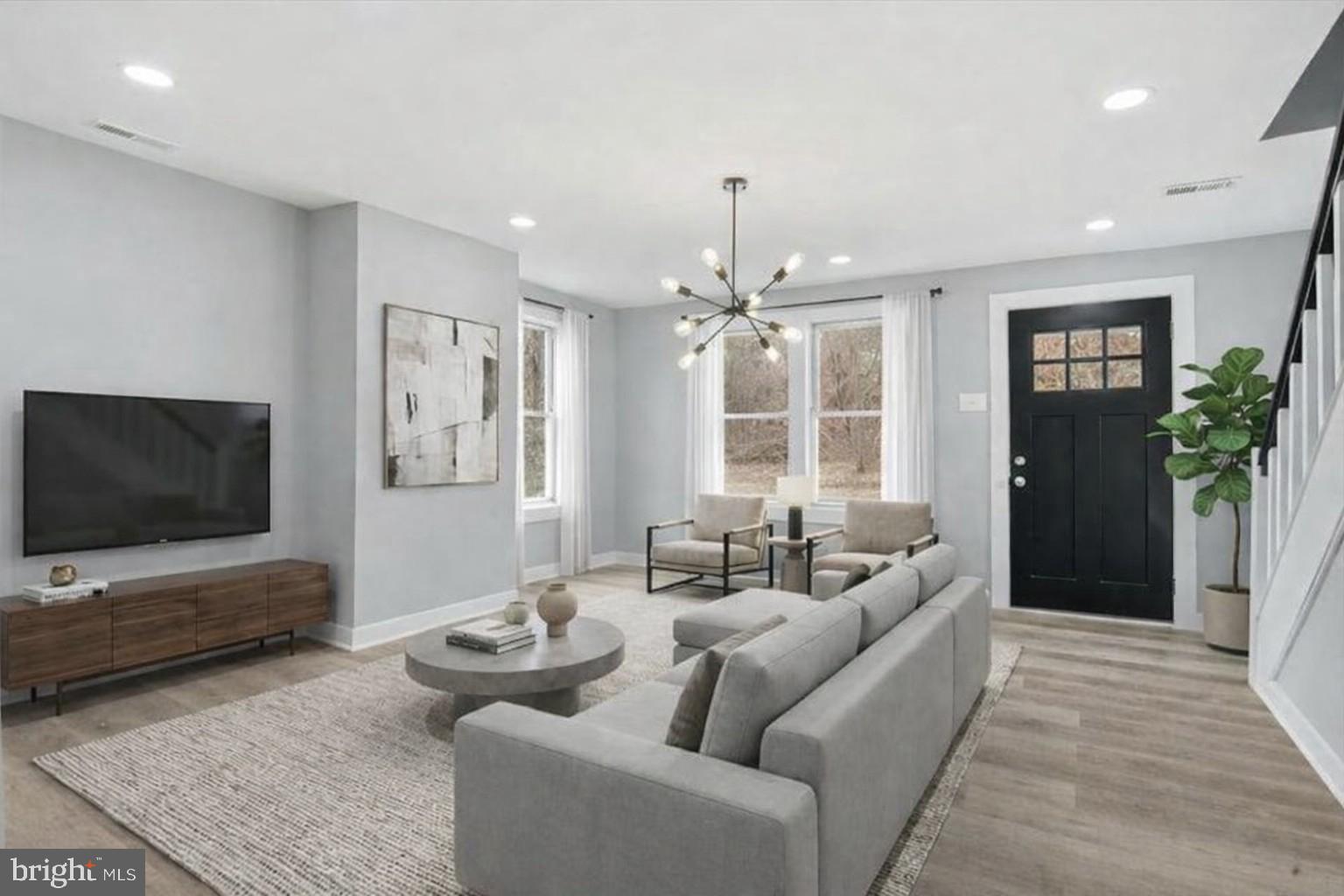 221 Denton Road Federalsburg, MD 21632 - Photo 7 of 33 a living room with furniture and a flat screen tv