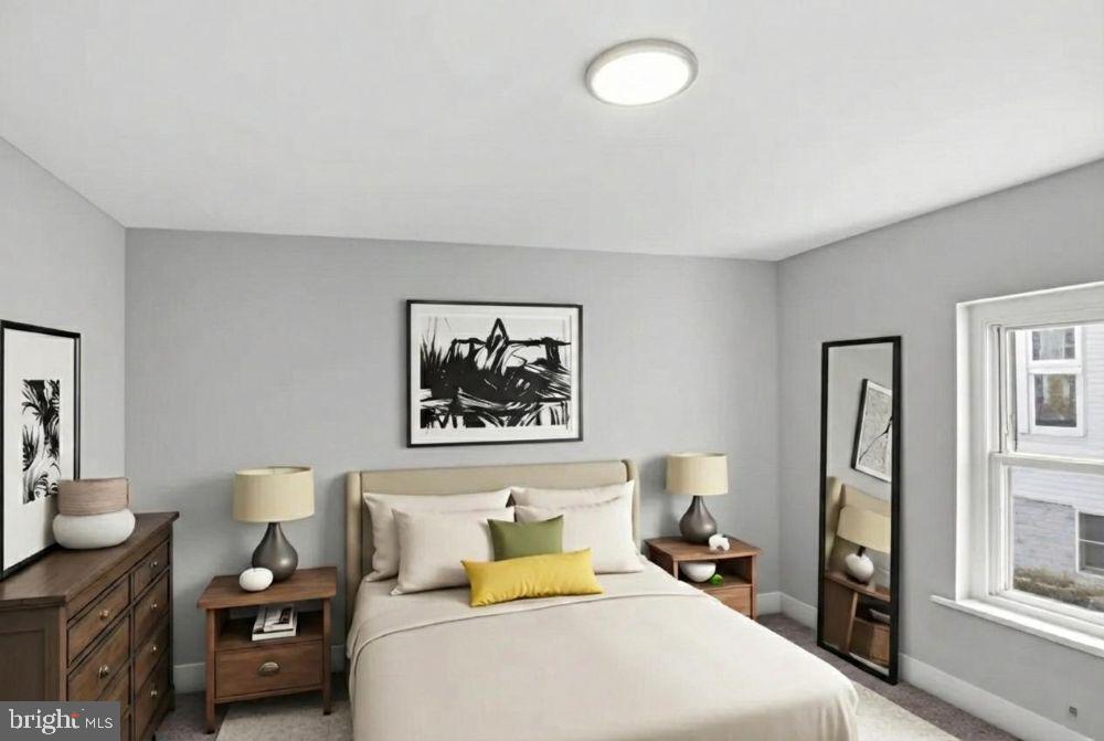 221 Denton Road Federalsburg, MD 21632 - Photo 9 of 33 a bedroom with a bed and wooden floor