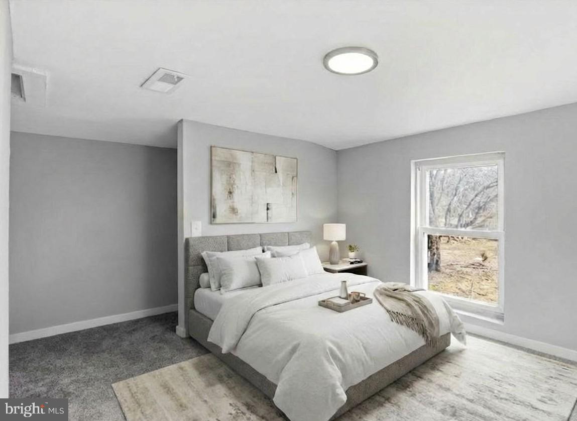 221 Denton Road Federalsburg, MD 21632 - Photo 10 of 33 a bedroom with a bed and a window