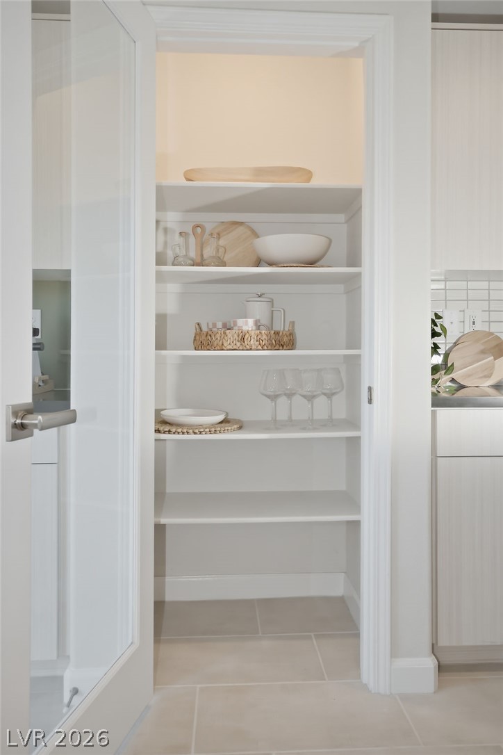 913 Cadence View Way Henderson, NV 89011 - Photo 22 of 46 Ample, neatly organized shelving provides convenient storage for kitchen essentials.