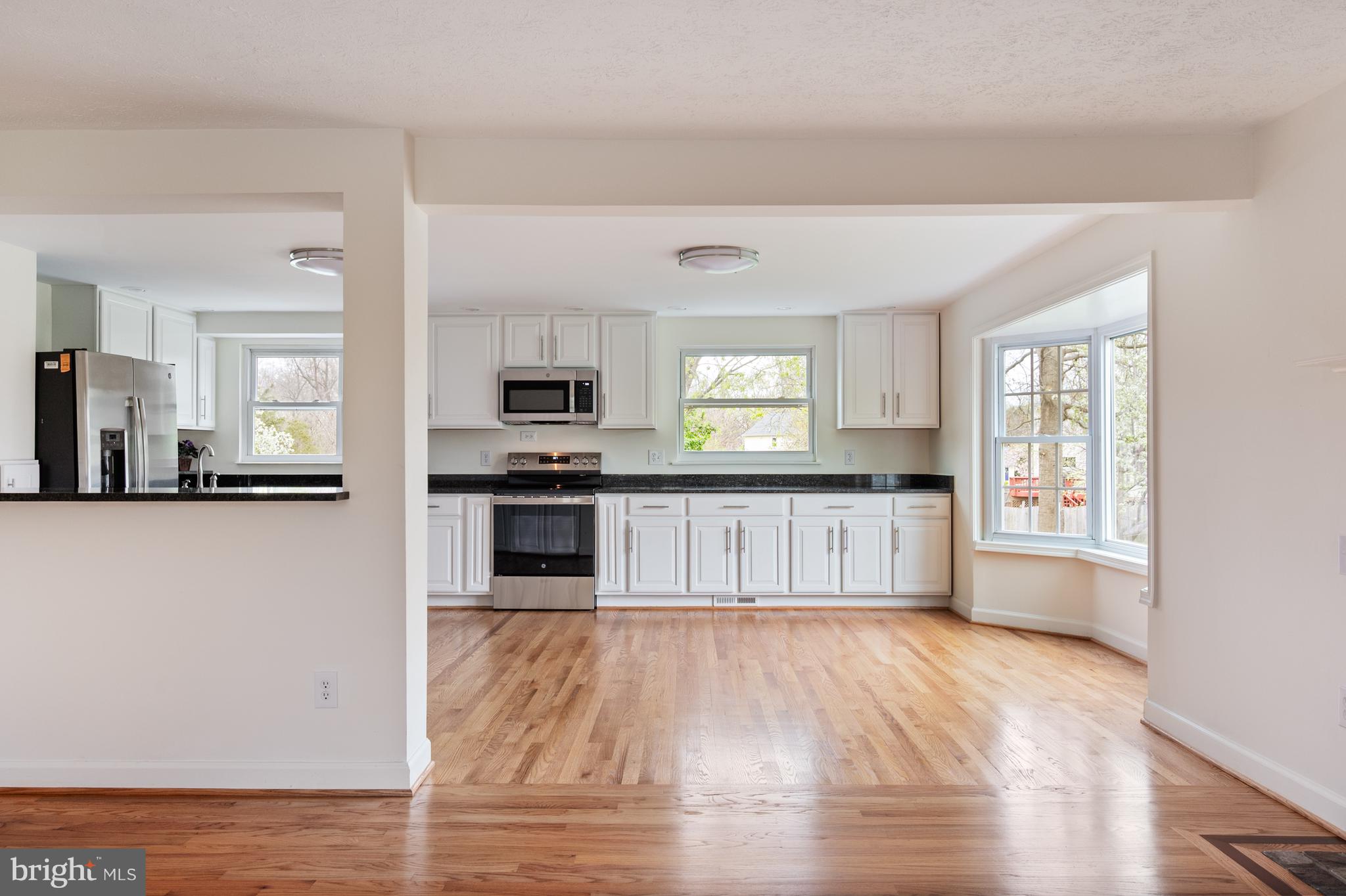 4417 Cub Run Road Chantilly, VA 20151 - Photo 15 of 57 a view of a kitchen with wooden floor and electronic appliances