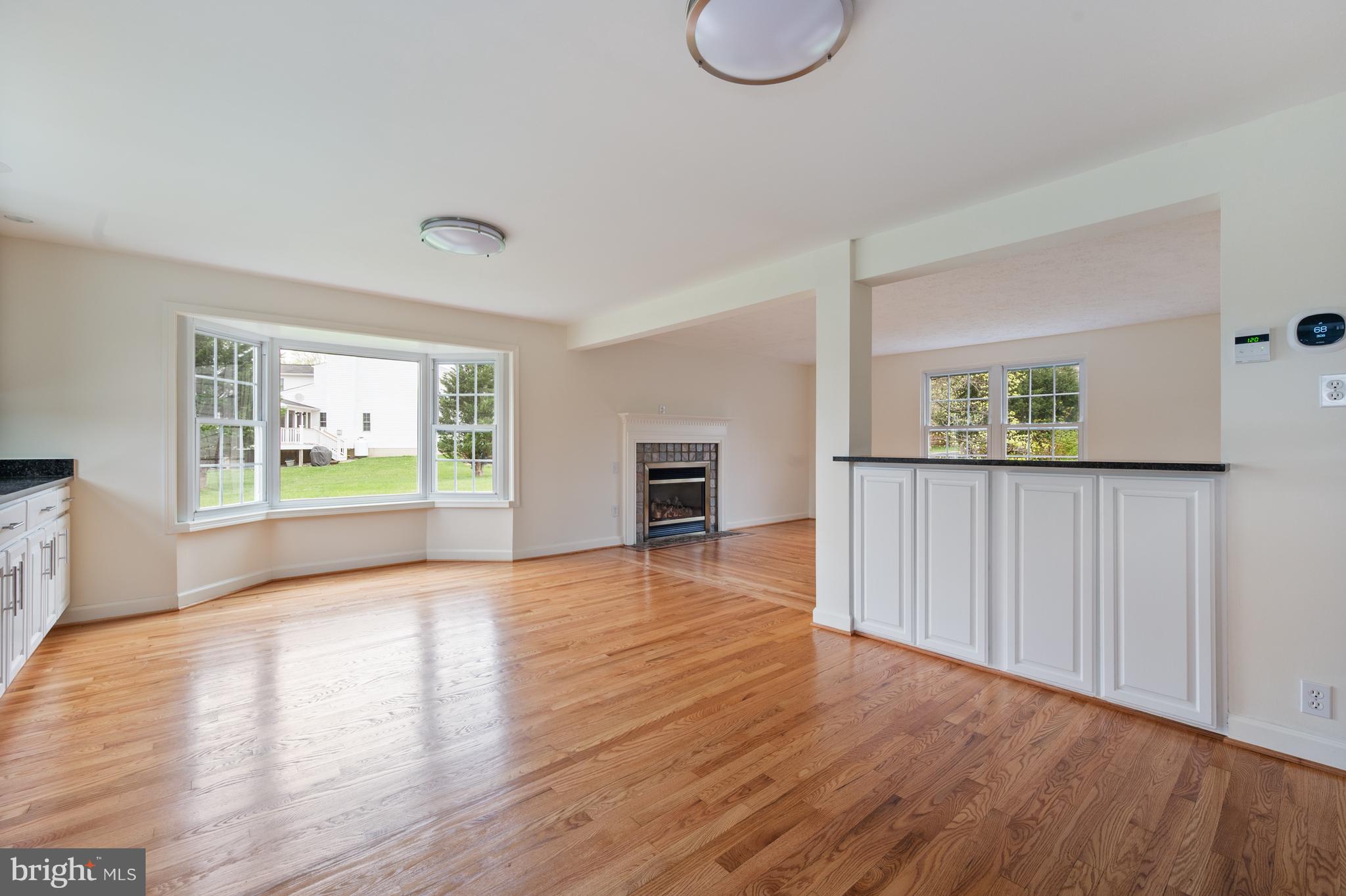4417 Cub Run Road Chantilly, VA 20151 - Photo 16 of 57 a view of an empty room with a window and wooden floor