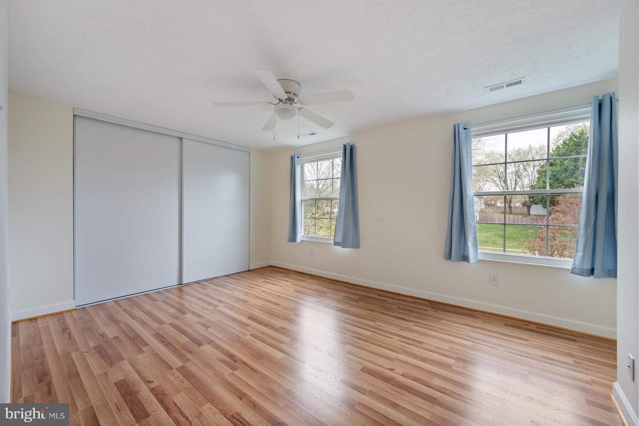 4417 Cub Run Road Chantilly, VA 20151 - Photo 28 of 57 a view of an empty room with wooden floor and a window