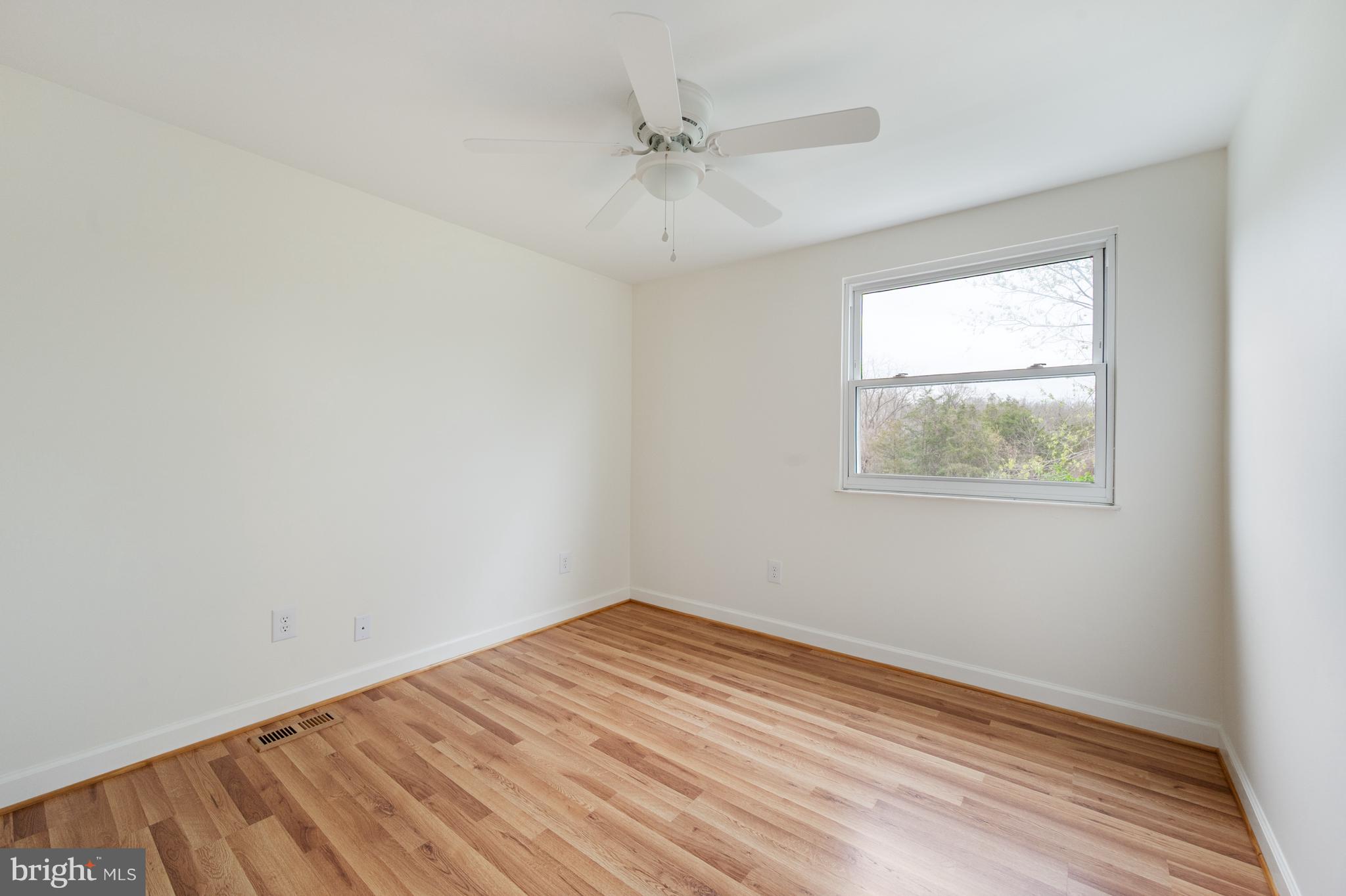 4417 Cub Run Road Chantilly, VA 20151 - Photo 29 of 57 an empty room with a window and a ceiling fan
