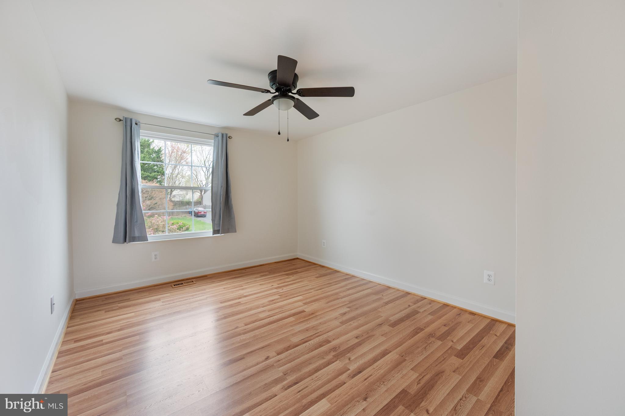 4417 Cub Run Road Chantilly, VA 20151 - Photo 30 of 57 an empty room with wooden floor fan and windows