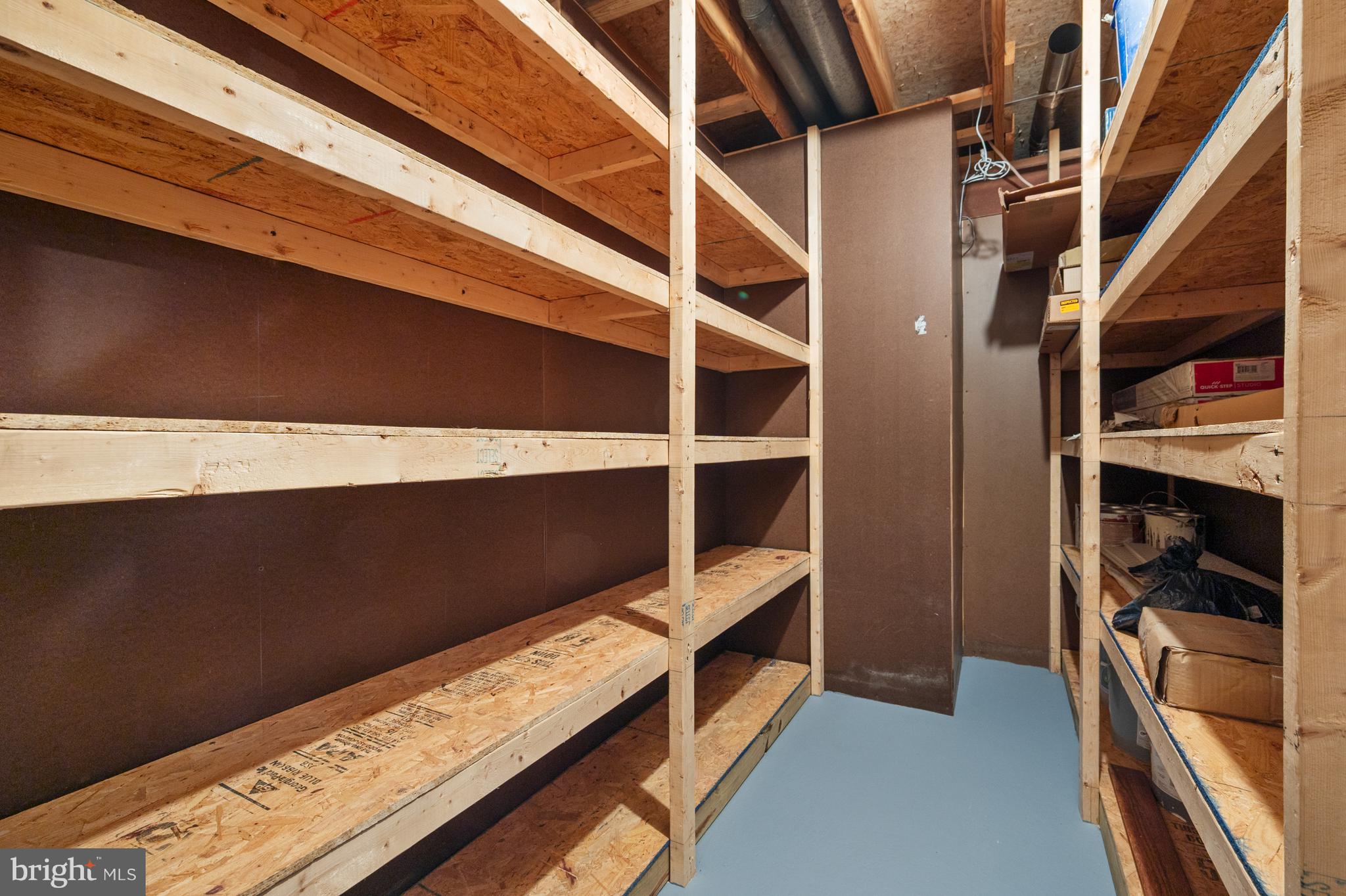 4417 Cub Run Road Chantilly, VA 20151 - Photo 36 of 57 a view of walk in closet with clothes and shoes