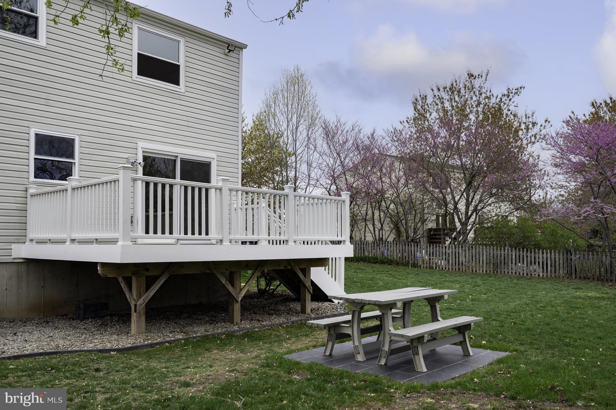 4417 Cub Run Road Chantilly, VA 20151 - Photo 38 of 57 a backyard of a house with table and chairs