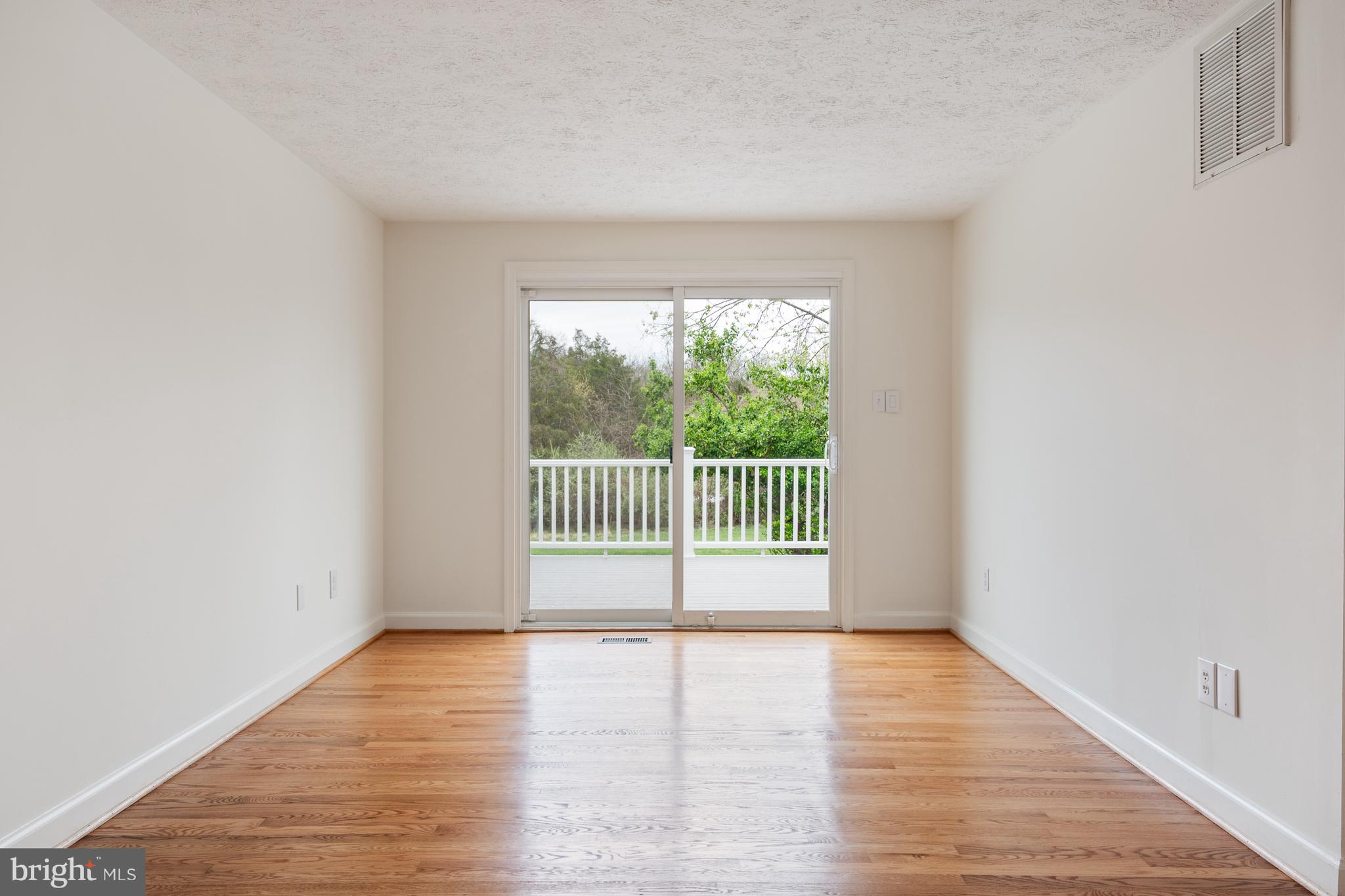 4417 Cub Run Road Chantilly, VA 20151 - Photo 10 of 57 a view of a room with wooden floor and a window