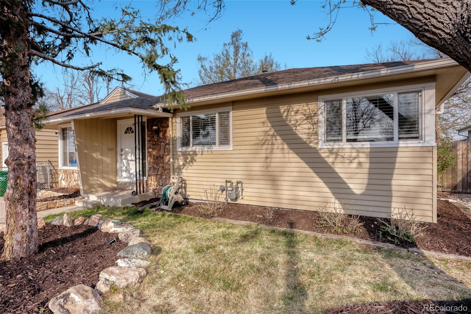 2356 Florence Street Aurora, CO 80010 - Photo 2 of 31 a view of a house with a yard