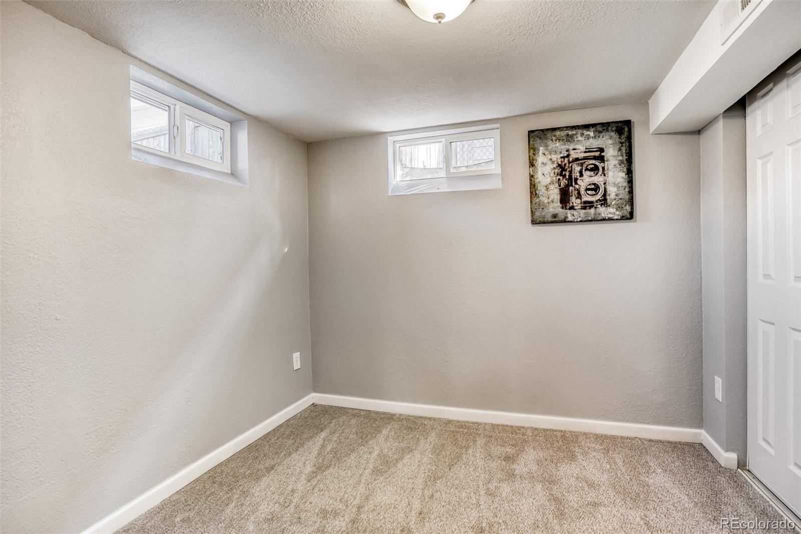 2356 Florence Street Aurora, CO 80010 - Photo 24 of 31 an empty room with windows