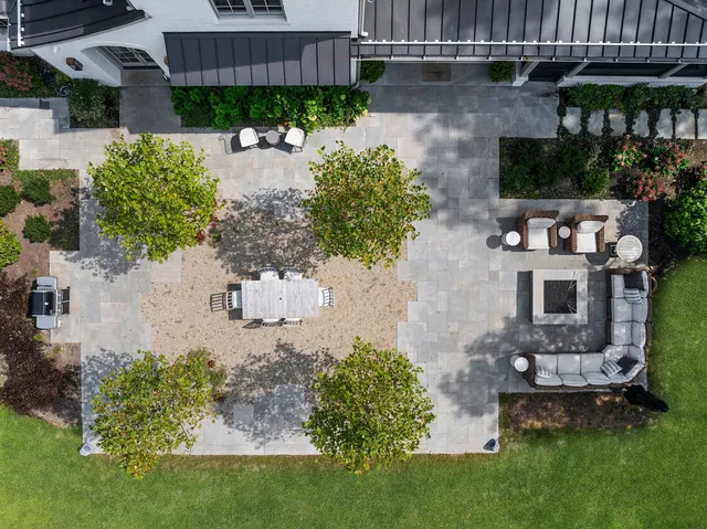 an aerial view of a house with a garden