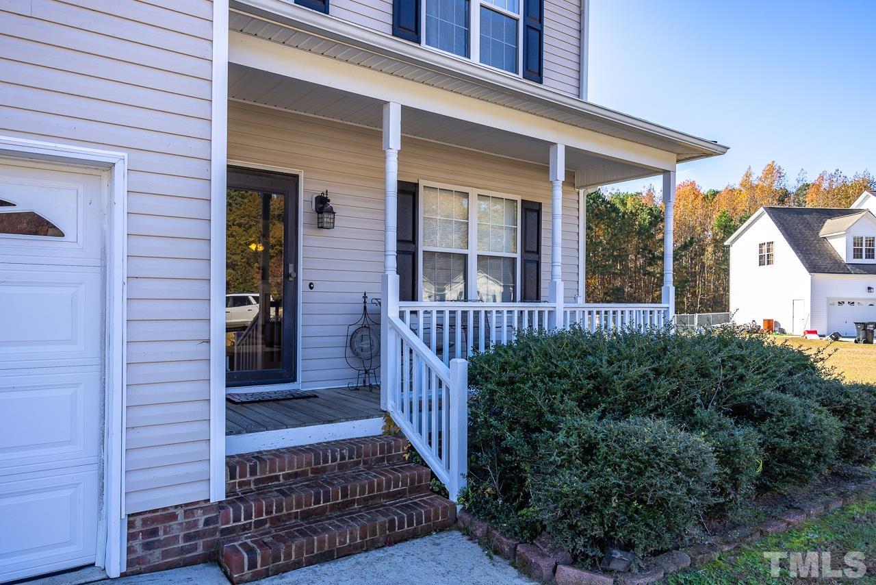 229 Roping Horn Way Willow Spring, NC 27592 - Photo 2 of 30 a view of a house with wooden deck