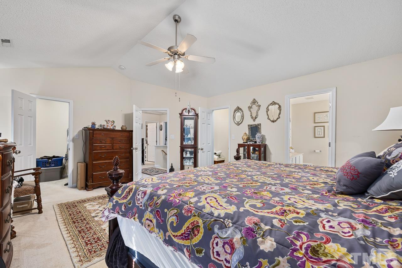 229 Roping Horn Way Willow Spring, NC 27592 - Photo 13 of 30 a bedroom with a bed and dresser