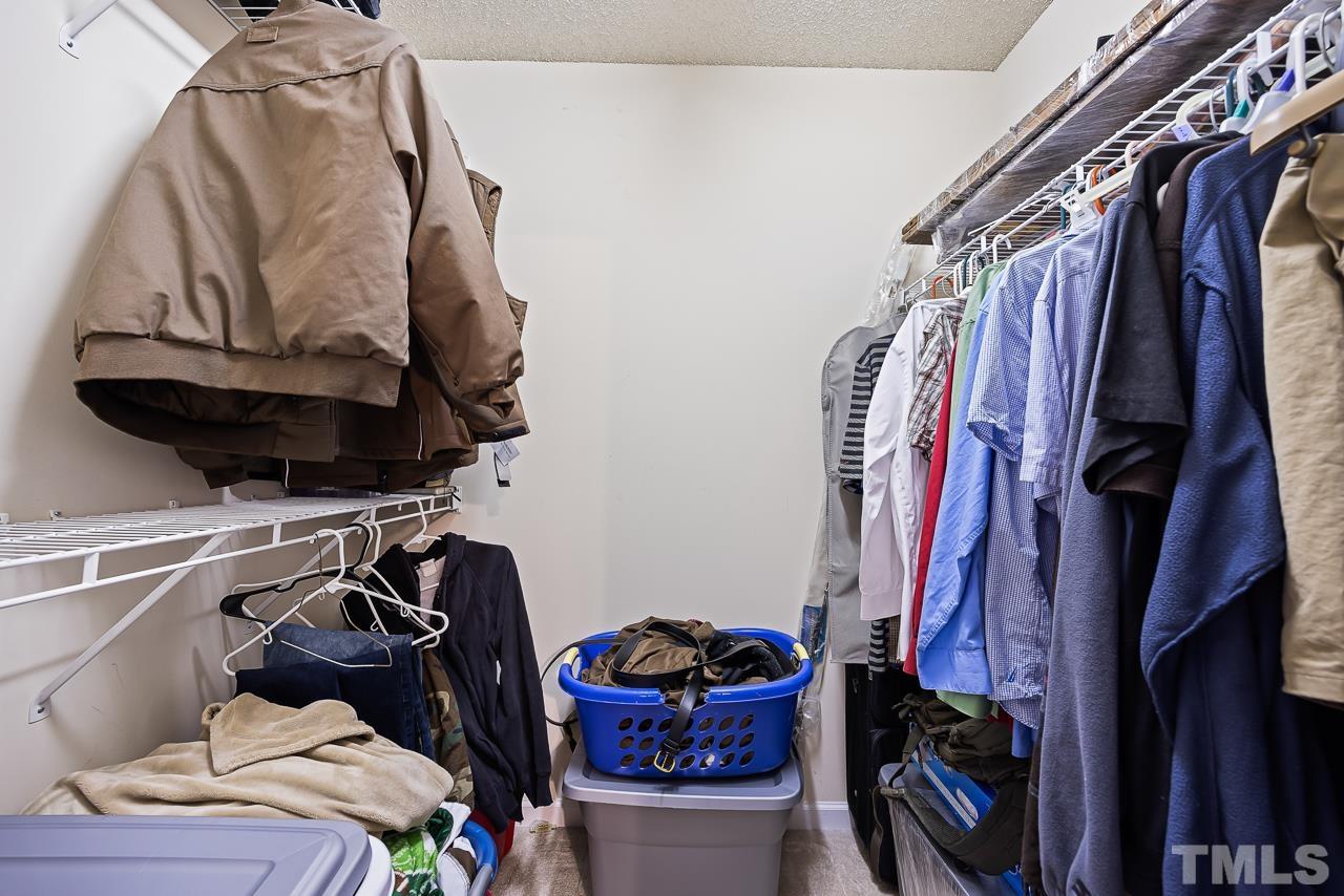 229 Roping Horn Way Willow Spring, NC 27592 - Photo 16 of 30 a view of walk in closet with clothes and shoes